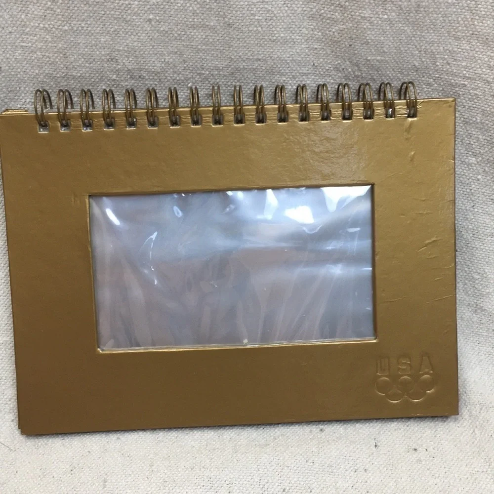 Spiral bound Olympic photo album/frame